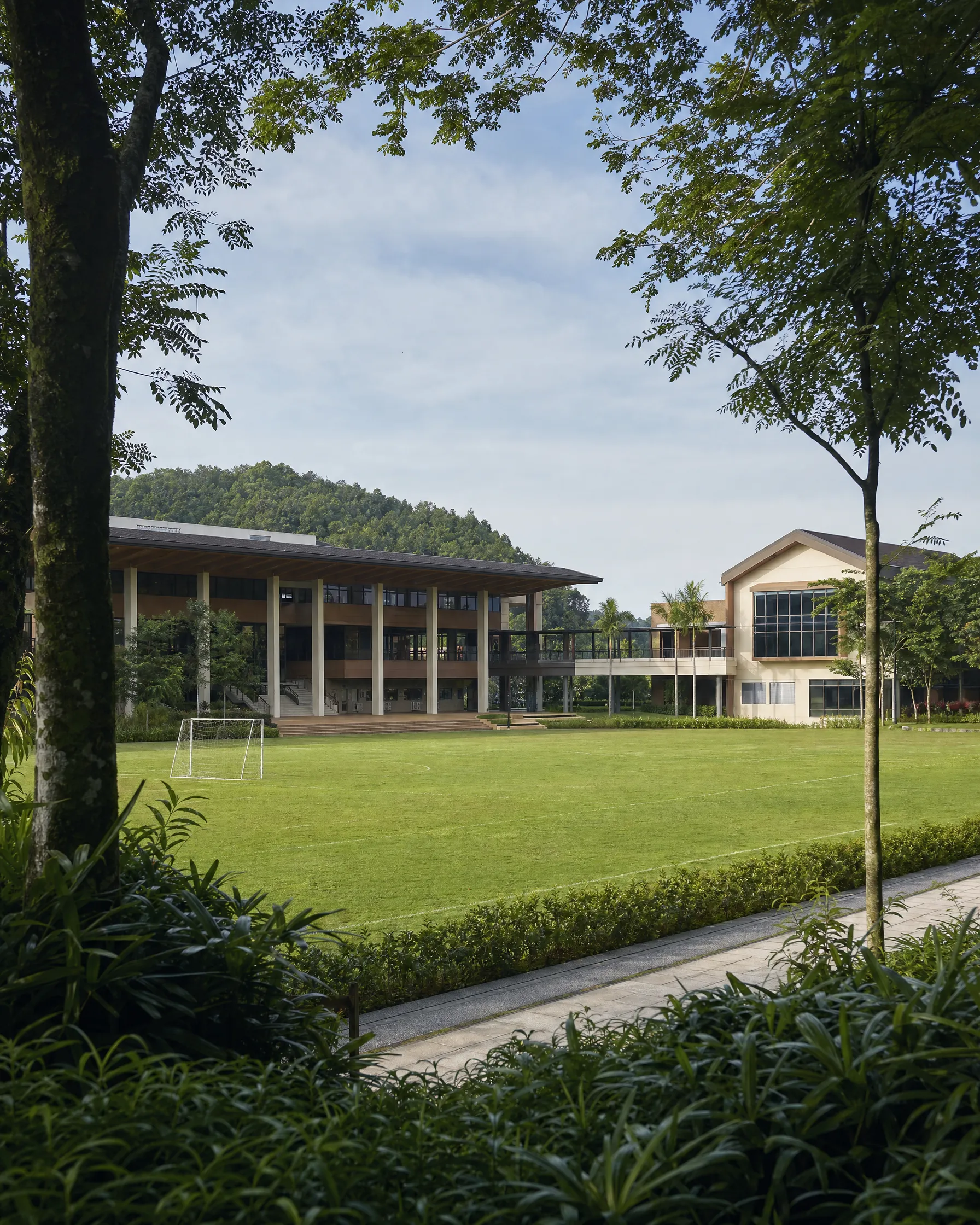 Tenby Schools campus building and playing field inside Eco Majestic